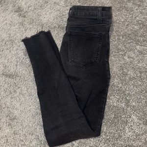 Black no boundaries super skinny high waisted jeans w frayed bottoms , size 1/XS